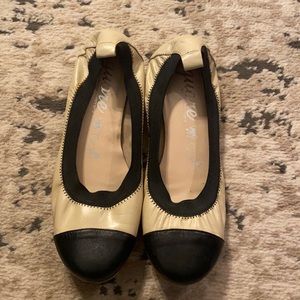 Black and creamy leather flats